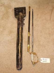 Modern US Navy Sword: Mfg by Japan Sword Co. Has scabbard, on one side has anchor and shield, other side has anchor. Lot includes sword, scabbard, & leather case.