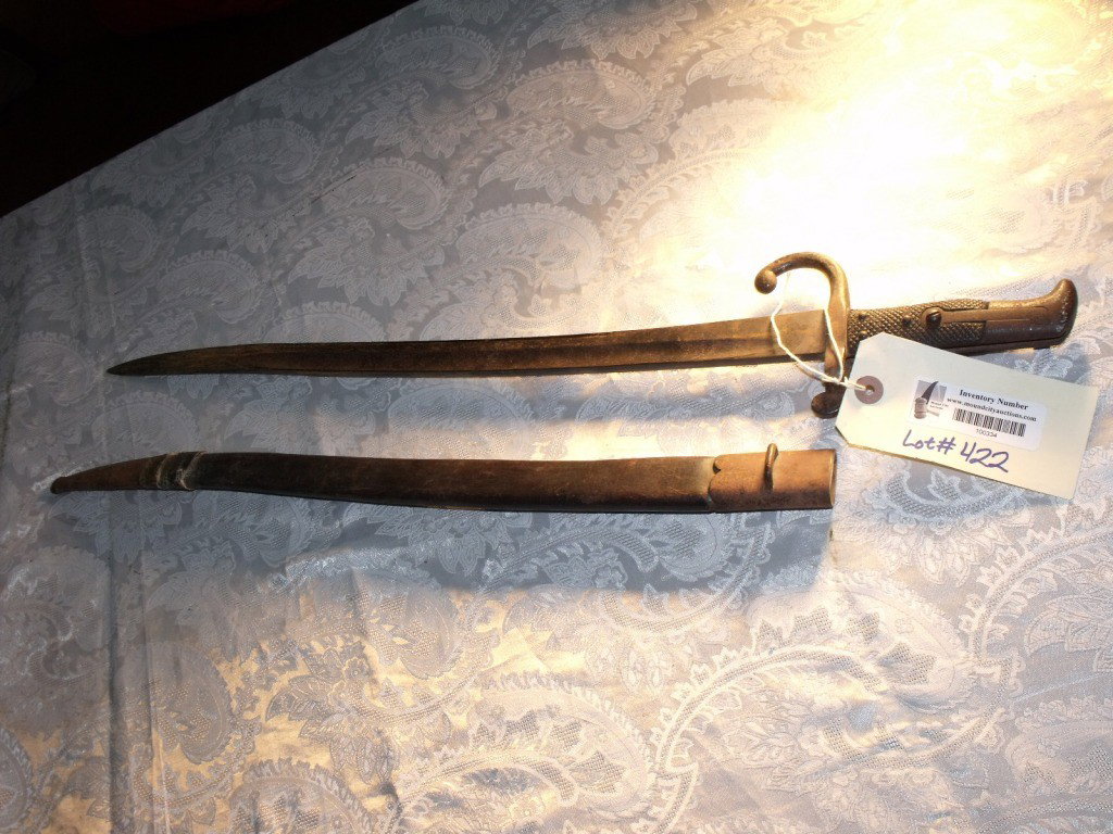 Bayonet, Danish: Danish Model 1867 Bayonet, Made for Model 1867 Rolling Block Rifle, Blade & metal has some surface rust, Black leather grips in good condition, Serial number 34484, Scabbard present but has break in l