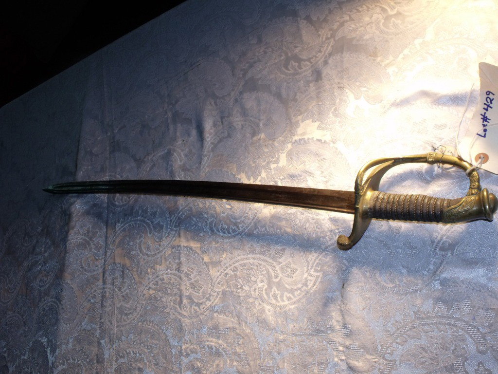 Sword, German: 19th Century Paul Luneschloss of Germany Make, Sharkskin Grip with wire wrap, Brass handguard, Blade has some surface rust but no pitting, Blade has been field sharpened, Scabbard missing.