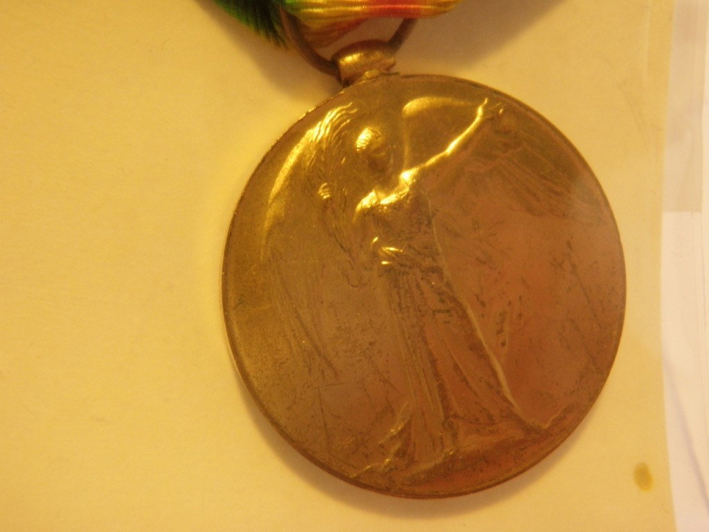 WWI Victory Medal: The ribbon's colors are those of two mirrored rainbows. A large number of categories, both civilians and forces personnel, qualified for this Victory Medal, although qualification was slightly more st
