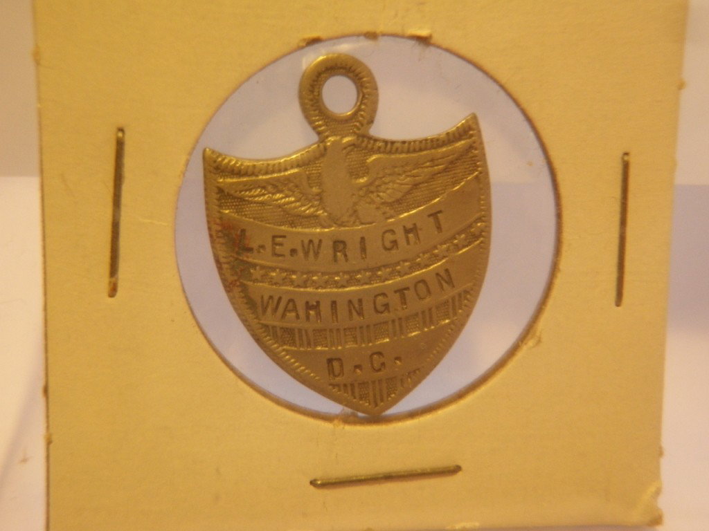 Vintage Medal: Marked "L.E. Wright Wahington (sic) D.C." on front and "Enl. July 15 1899 GO-A-3rd-Reg U.S.V.E." on back.