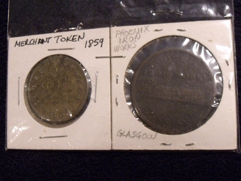 Two Antique Tokens: One marked "Phoenix Iron Works Glasgow" on reverse and "Penny Token 1814". Second token is marked "James Adwick 2D 1859" on obverse and "Old Inn" on reverse
