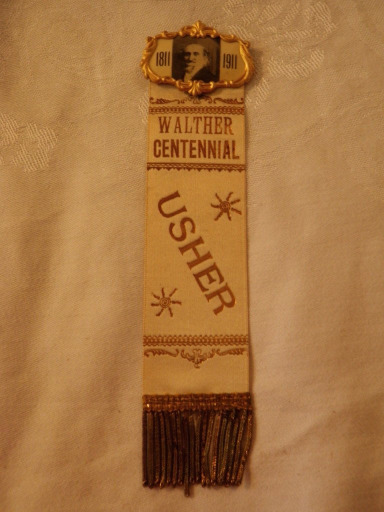 1811-1911 Centennial Ribbon: 1811-1911 Walther Centennial Usher Ribbon, shows image of older man on celluloid, (man looks like grampa from the Munsters in my opinion).
