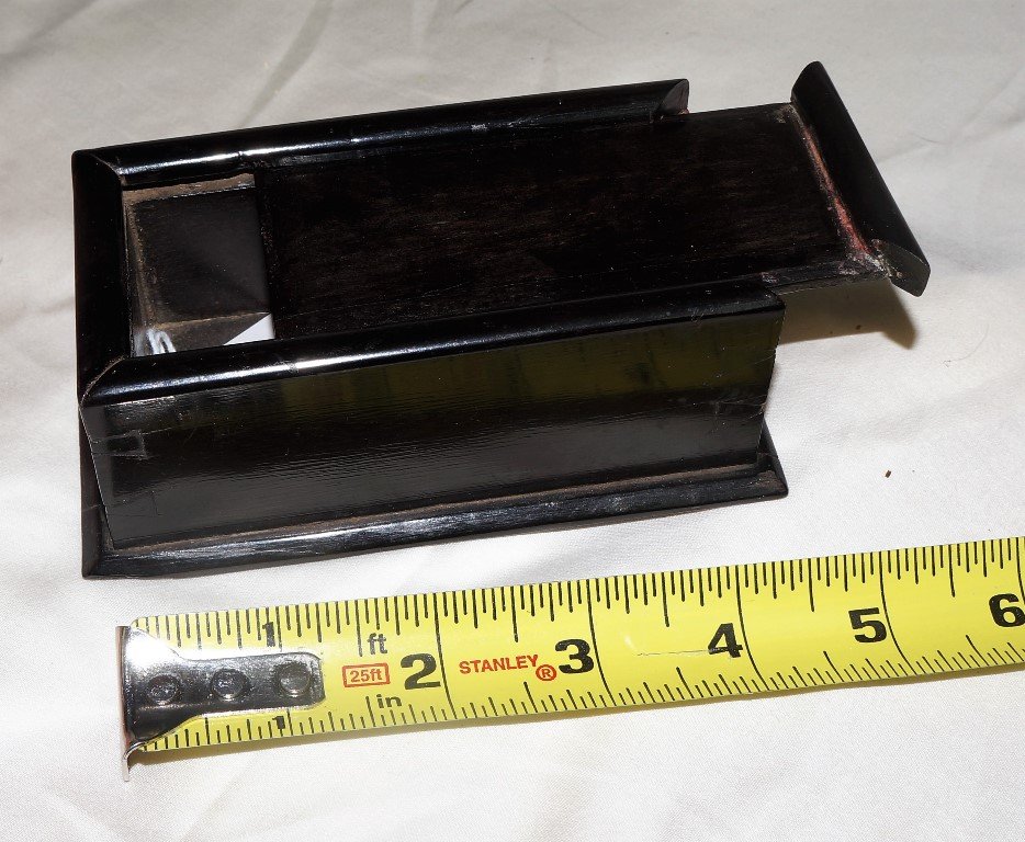 Ebony Miniature Sliding Lid Trinket Box It is the best: Ebony Miniature Sliding Lid Trinket Box It is the best with very small dovetailing, the base is screwed on. It is in excellent condition. 4.5 inches by 3.5 inches by 2 inches. Possibly the work of a s