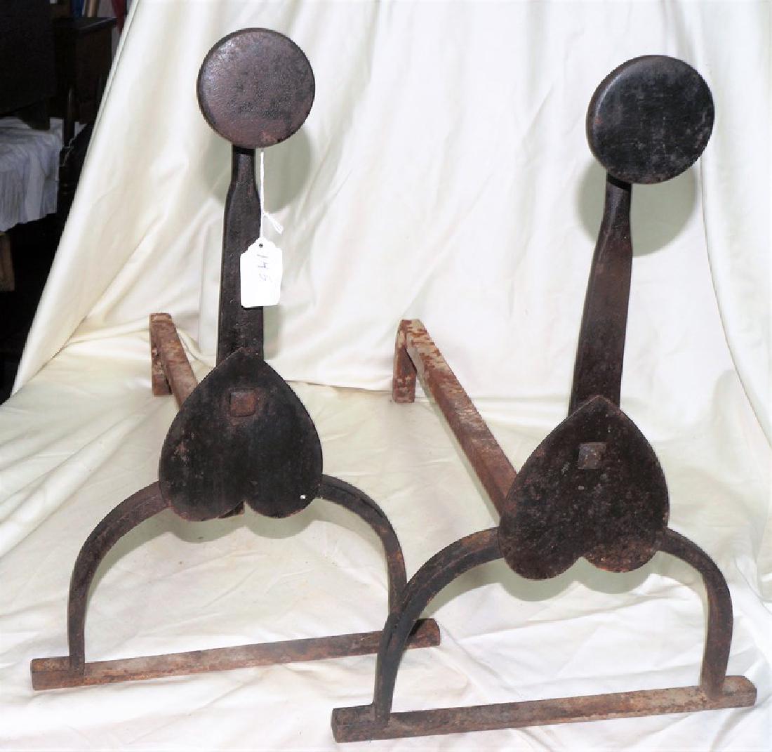 18th Century Andirons with Heart Motif They are hand: 18th Century Andirons with Heart Motif They are hand wrought and in excellent condition. They are 18 inches tall, 12 inches wide, and the wood holders are 22 inches long. These andirons are shown in f