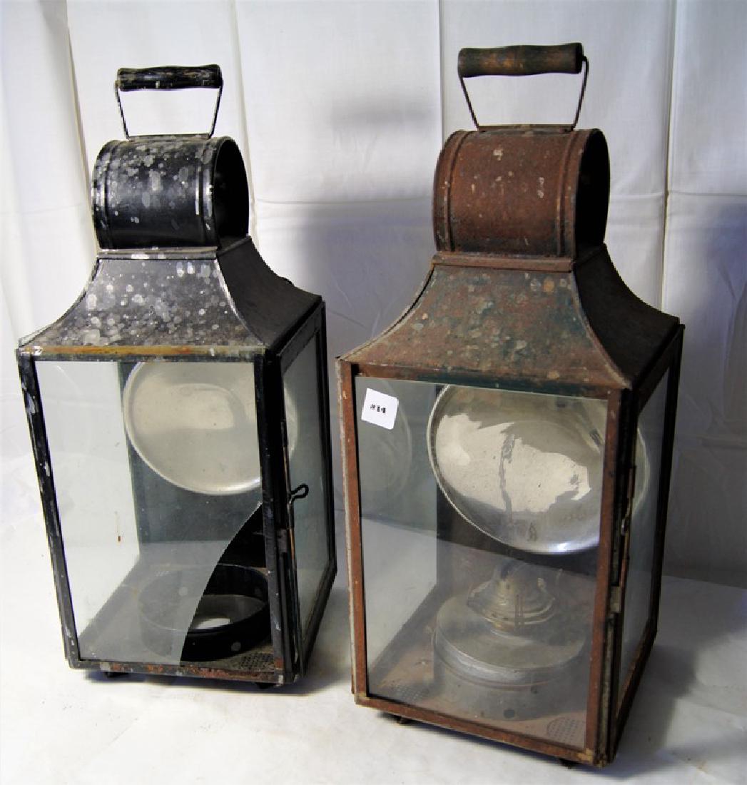 Lot of 2 barn lanterns, one complete with original tin: Lot of 2 barn lanterns, one complete with original tin burner and reflector, the other with reflector but missing burner with a broken glass panel, old rust finish