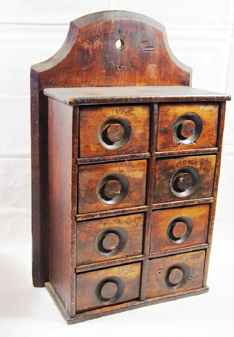 Victorian walnut 8 drawer wall hanging spice cabinet,: Victorian walnut 8 drawer wall hanging spice cabinet, Each drawer with recessed carved knobs and above faint stenciling in black letters to identify drawers contents incl Cloves, Soda, Ginger, Nutmeg,