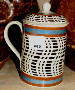 Mid-19th c. Mochaware large drinking mug w/rare lid: Mid-19th c. Mochaware large drinking mug with matching cover having an applied handle with all over psychadelic dot and dash tapestry design on mug and blue and brown stripes above and below. Every pi