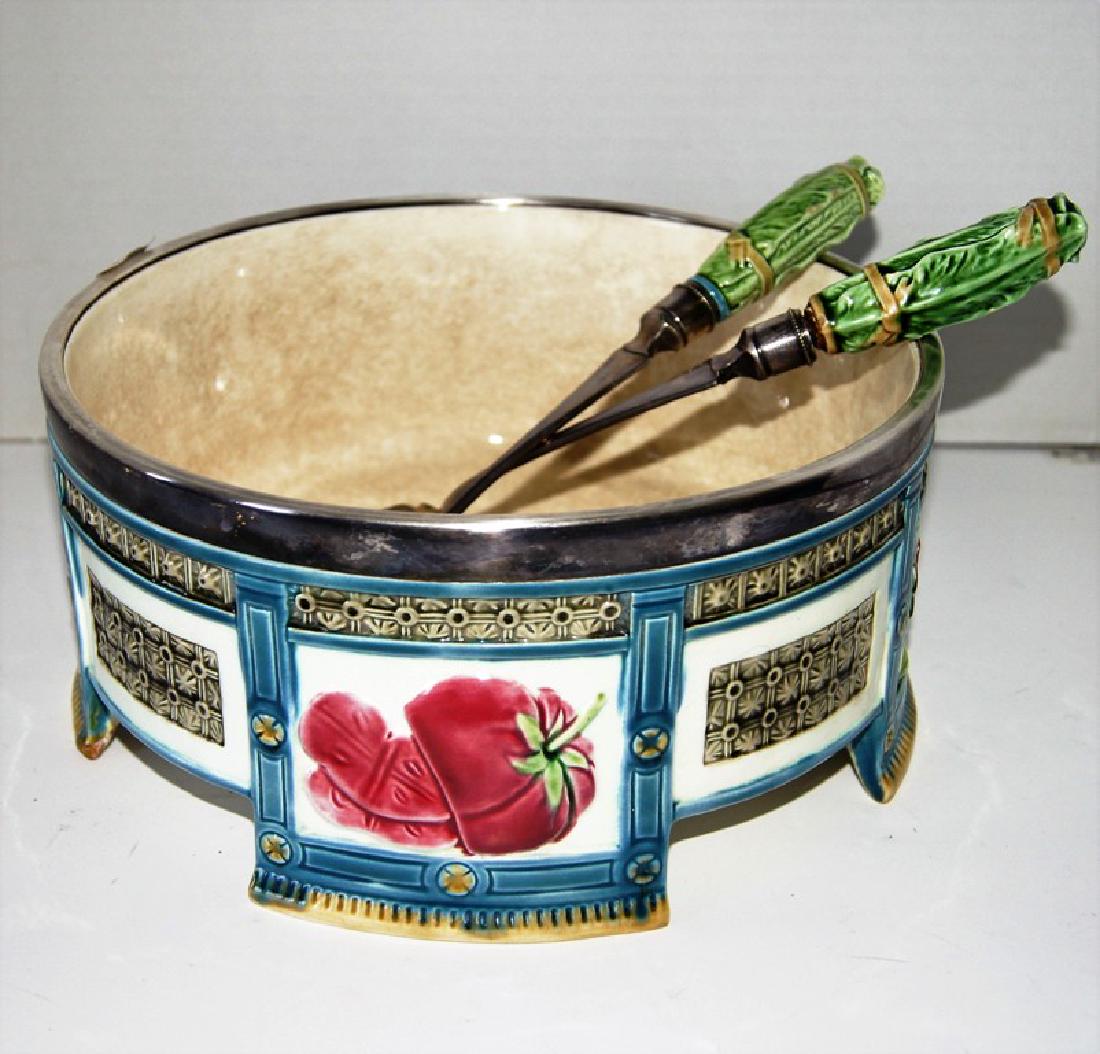 Wedgwood majolica salad bowl with serving fork and: Wedgwood majolica salad bowl with serving fork and spoon, with decorated panels depicting radishes, tomato, handles of serving pieces in lettuce leaf motif. Condition wise, there is an old repair on o