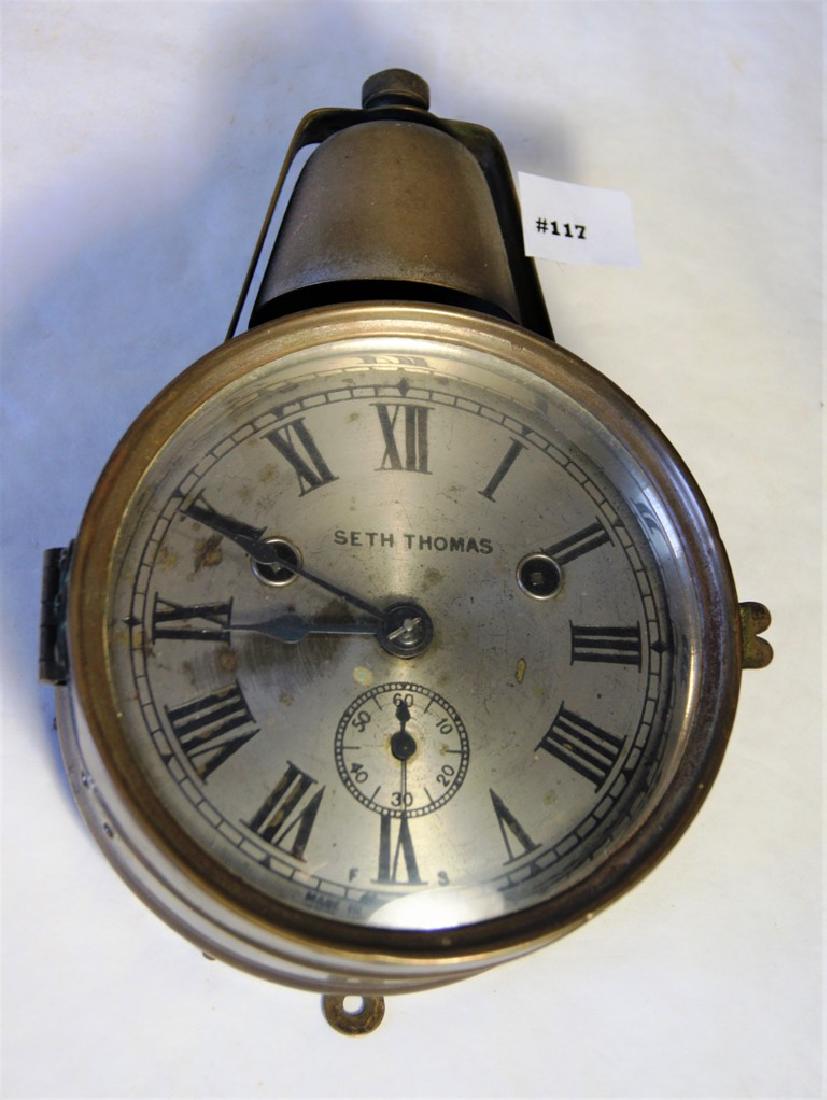 Seth Thomas "Yacht Bell" ship's clock, nickel plated: Seth Thomas "Yacht Bell" ship's clock, nickel plated brass case. 8-day time & strike w/seconds bit, wood back with original paper label, circa 1880's. Very few clocks of this style were made. 9 1/2" o