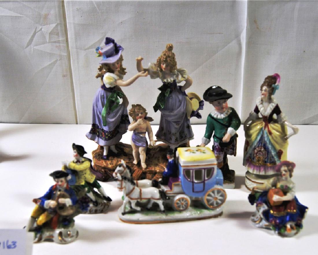 Lot of 7 assorted German and French figurines incl a: Lot of 7 assorted German and French figurines incl a group figure with 2 ladies with bonnet standing with a cupid at their feet, a small 2 horse coach with driver, and other assorted small size figuri