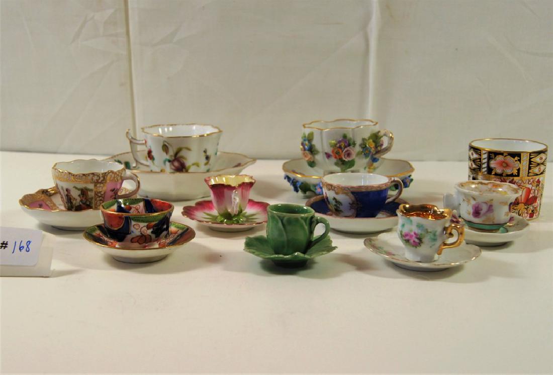 Lot of 7 doll's size (demitasse) cups and saucers along: Lot of 7 doll's size (demitasse) cups and saucers along with a Royal Crown Derby mug, small Meissen cup and saucer with raised flowers, 2 Dresden cup and saucers with blue "R" mark, etc.