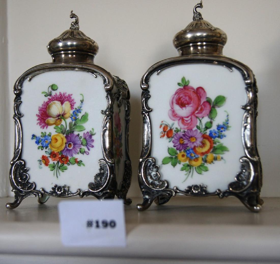 Pair of German porcelain tea caddies or cannisters,: Pair of German porcelain tea caddies or cannisters, with silver embossed trim having floral decoration on all sides. KPM, 6" ht.