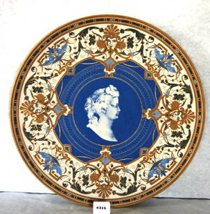 Villeroy and Boch Hanging Plaque Charger, Mettlach: Villeroy and Boch Hanging Plaque Charger, Mettlach #879, 14" dia. Blue ground with woman portrait at center, birds, faces and floral decoration, Incised with "879" on bottom, with Villeroy and Boch tr