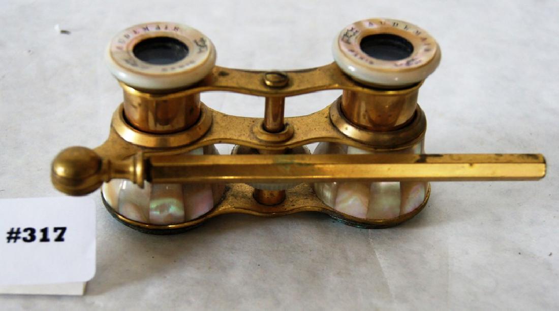 Pair of fine pair of French binocular opera glasses: Pair of fine pair of French binocular opera glasses Mother of pearl decorated with mounted 5" gilt handle, signed on eye optic AUDEMAIR / PARIS, ca 1870