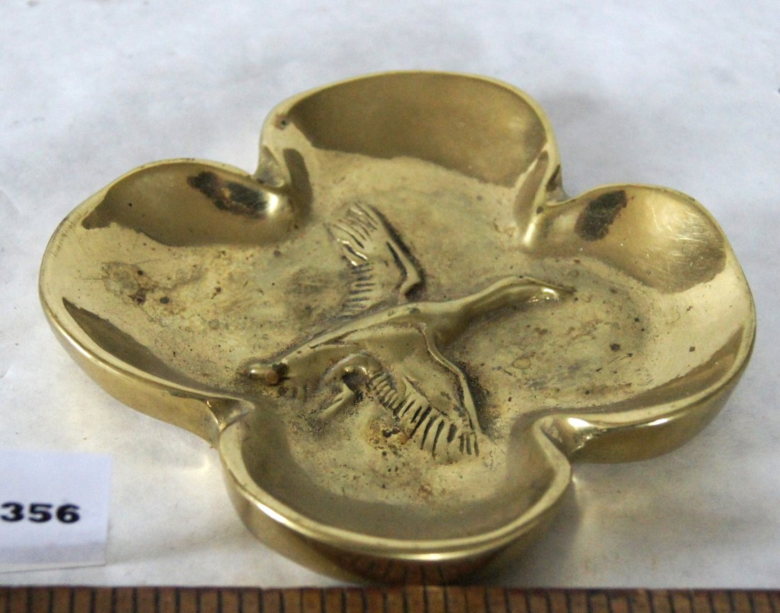 VM Bronze 4 leaf clover paperweight with duck: Bronze 4 leaf clover paperweight with flying goose or duck on front, very heavy casting, maybe an ashtray, beneath marked with VM logo for Virginia Metalcrafters
