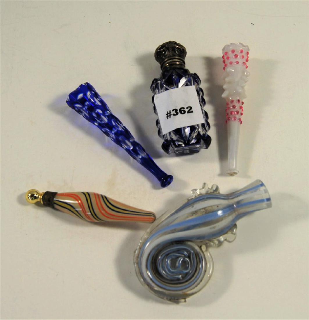 Set of 5 perfume bottles and two cigarette holders.: Set of 5 perfume bottles and two cigarette holders. Multi colored glass.