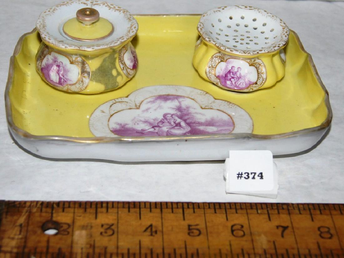 Meissen 4 pc desk set with inkwell & tray, yellow/whit: Meissen 4 pc desk set with inkwell, penholder jar and tray, yellow field with white panels. Marked with blue crossed swords mark, ink pot has a crack