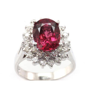 Genuine Rubellite Tourmaline 4.60 ctw Diamond Ring 10K: Main Stone: Tourmaline; Total CTW: 4.6 ctw ; Metal Purity: 10KTGold ; Ring Size: 7; Diamond Count 1: 32 RoundCut; Diamond CTW 1: 0.7; Clarity: I-1; Diamond Color: G-H; Gemstone Count: 1 OvalCut; Gemst