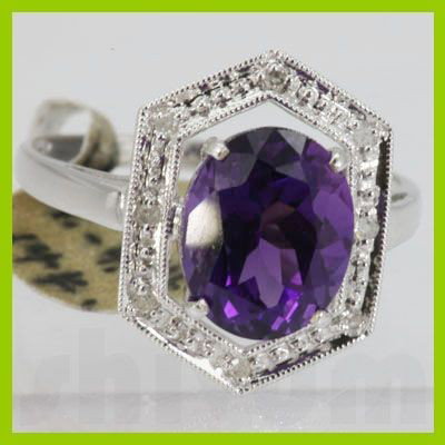 Genuine 4.19 ctw Garnet Ring 14KT White Gold: Main Stone: Garnet ; Carat Weight: 4.19ctw ; Gold Carat:14KT; Metal: White Gold ; Ring Size: 7.25 ; Diamond Weight: 0.05 ; Gemstone Carat Weight: 4.14; Cut: OVAL ; MSRP: $604