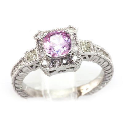 Genuine Pink Sapphire 1.45 ctw & Diamond Ring 10K: Genuine Pink Sapphire 1.45 ctw & Diamond Ring 10K **|**|** Main Stone: Pink Sapphire; Total CTW: 1.45 ctw ; Metal Purity: 10KTGold ; Ring Size: 6.75; Diamond Count 1: 24 RoundCut; Diamond CTW 1: 0.38;