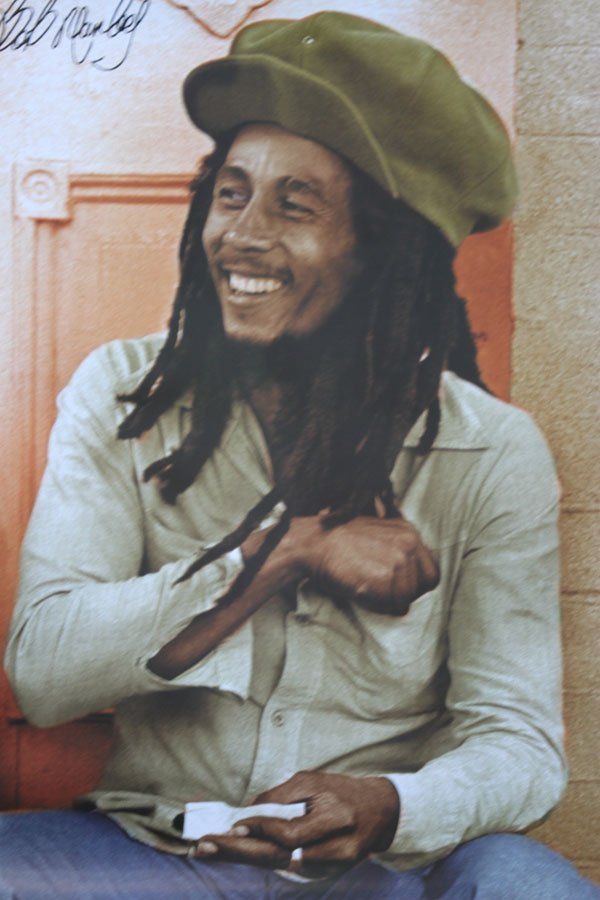 SITTING AND ROLLING A JOINT HAND SIGNED BY BOB MARLEY: SITTING AND ROLLING A JOINT HAND SIGNED BY BOB MARLEY **|**|** 24X36INCHES;UNFRAMED; Bob Marley (1945 - 1981), was a Jamaican singer, songwriter, and guitarist. His best known songs are a mixture of r