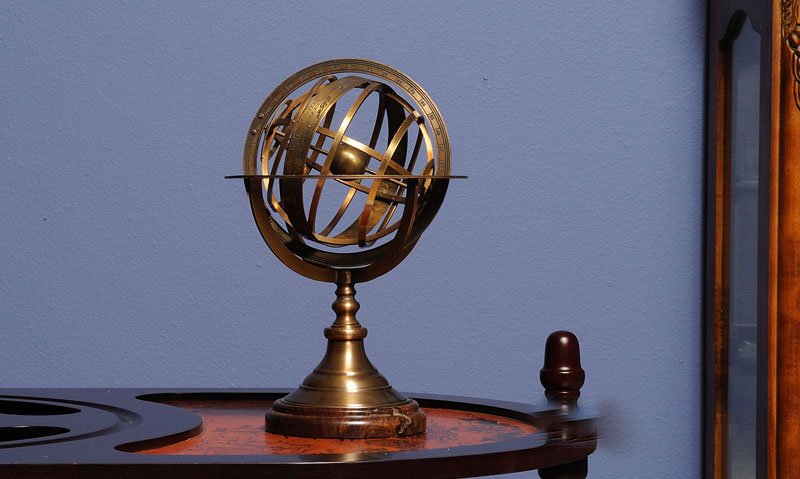 Collectible Armillary Sphere on wood base: Collectible Armillary Sphere on wood base **|**|** This golden Titanic brass bell was originally used on cruised ships to signal for meal time. When struck the bell sounds off clear and distinct. It c