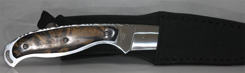 COLLECTORS EDITION 8.5" MAXAM FIXED BLADE HUNTING KNIFE: COLLECTORS EDITION 8.5" MAXAM FIXED BLADE HUNTING KNIFE **|**|** Maxam Fixed Blade Hunting Knife. Features polished stainless steel honed blade, faux tiger eye handle and nylon sheath with belt loop. 