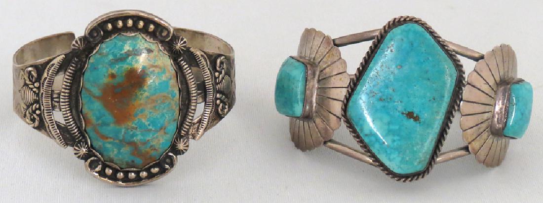 (on 2) NAVAJO SILVER AND TURQUOISE CUFF BRACELETS: one marked STERLING, also has illegible impressed mark, with a large oval turquoise set in pierced band with etched arrow design to s