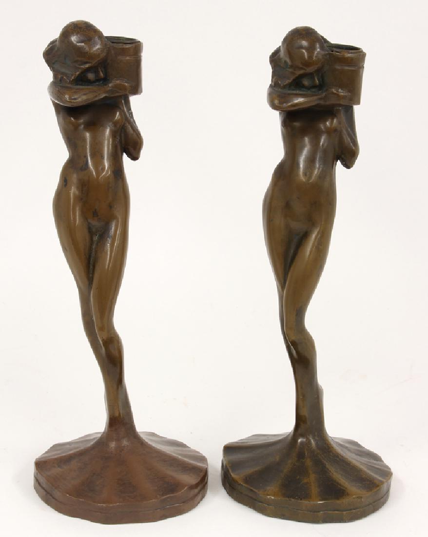 PAIR OF DECO BRONZED FIGURAL CANDLESTICKS: after Frankart, marked Co. 1922, standing nude on a flared lily pad, holding a vessel-form candle cup, 12.5"h