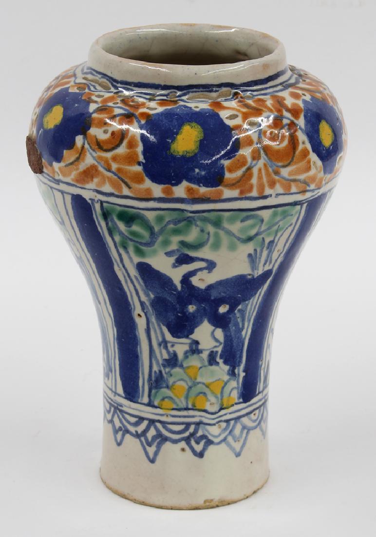 TALAVERA POBLANA POLYCHROMED EARTHENWARE VASE: Mexico, 18th c. or earlier, baluster-form, the shoulder with band of blue and yellow flowers with orange leaves, three panels below with long-legged blue birds in a stylized landscape, 7.5"tall