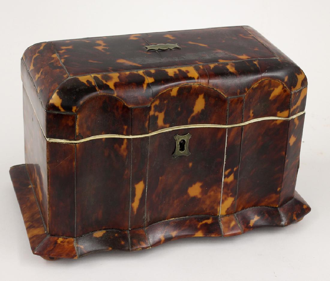 GEORGIAN SHELL TEA CADDY: block-front form with skirt, silver escutcheon and mount to lid, double lidded interior with tortoise lids, wood bun feet, 5"h; 8"w; 5"d