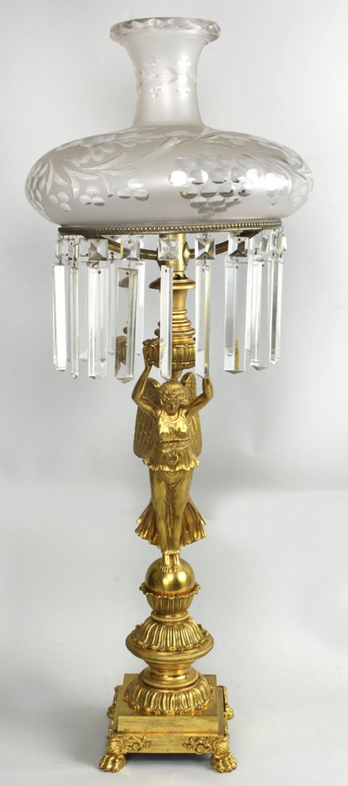 FRENCH FIREGILT BRONZE SINUMBRA LAMP: 19th c., winged Victory standing on an orb and plinth holding aloft the etched glass shade with prisms, 38"h