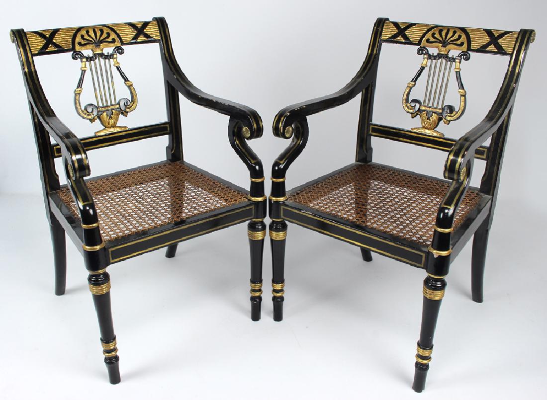 PAIR OF ENGLISH REGENCY BRASS-INLAID ARMCHAIRS: black paint with gilt enhancements, double line brass inlay to stiles and scrolling arms, lyre-form splats, caned seats, 36"h; 21.5"w