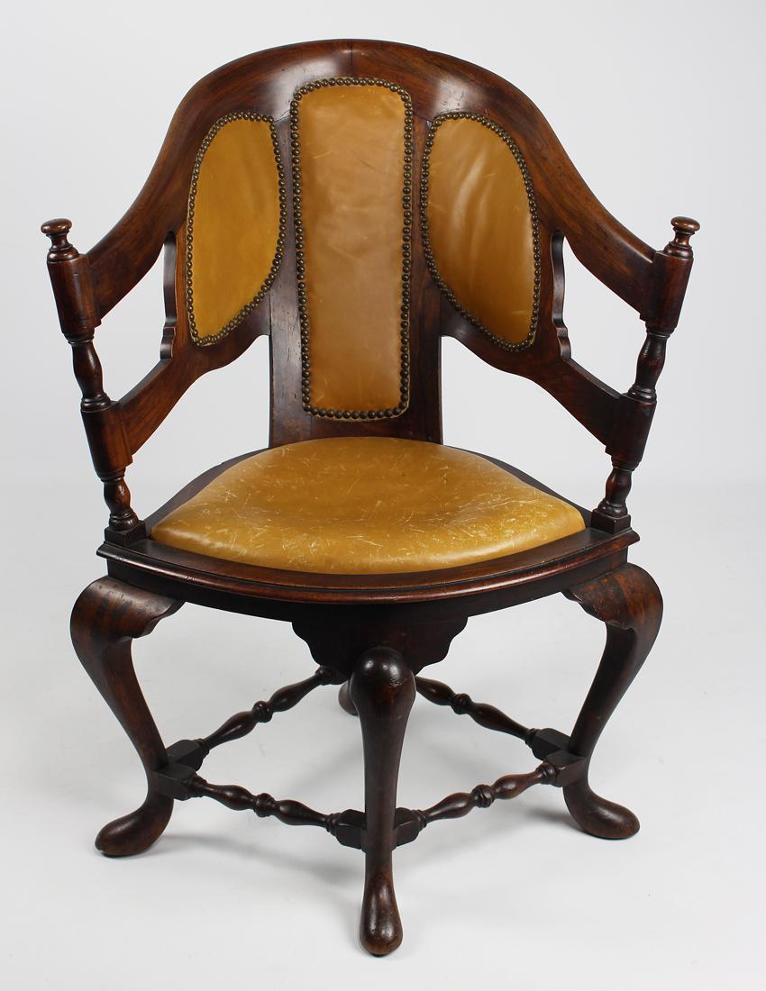UNUSUAL PORTUGUESE WALNUT CORNER CHAIR: 19th c., barrel-back, upholstered seat and back, cabriole legs joined by stretchers, on pad feet, 37"h; 29"w; 28"d