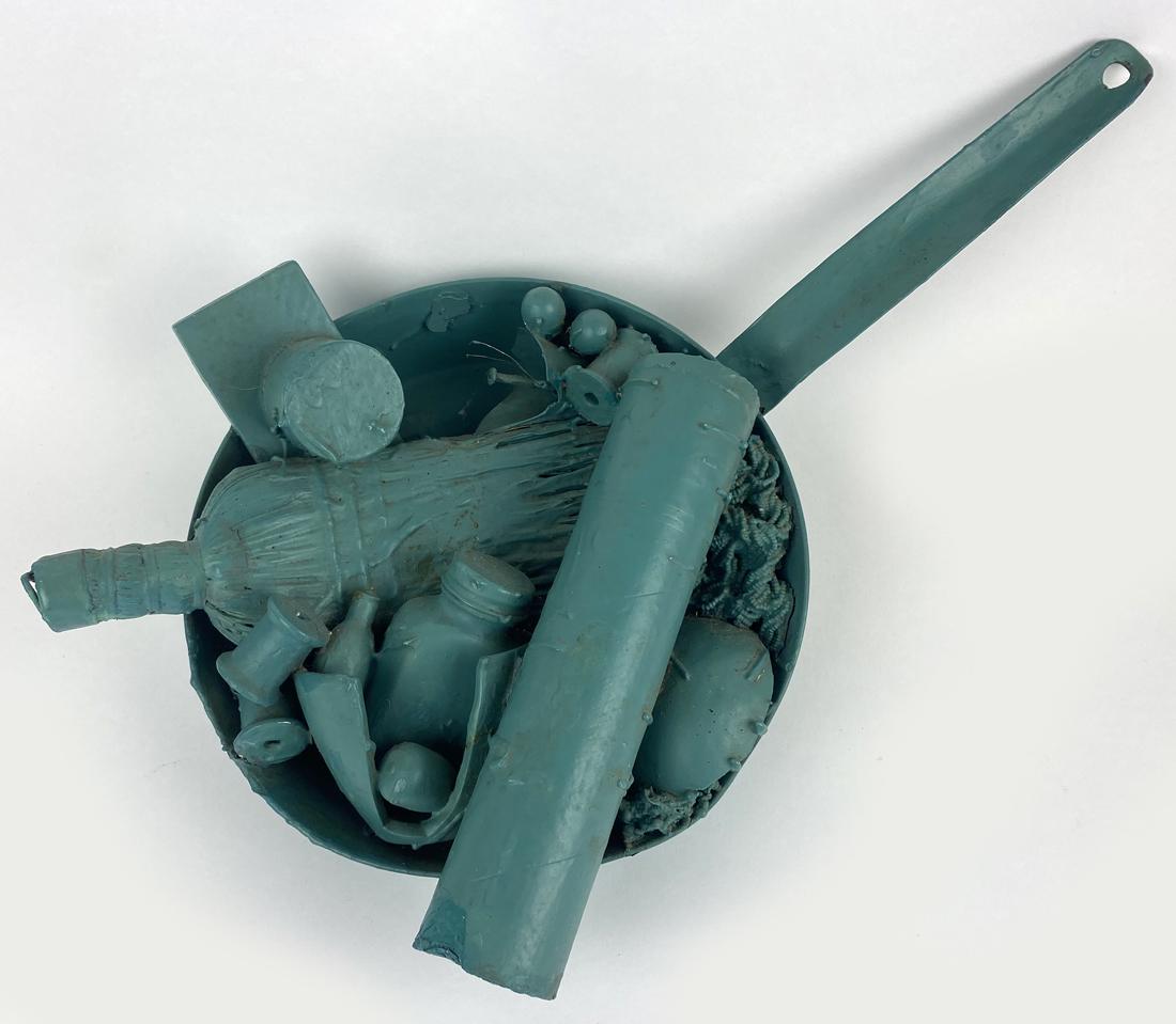 MAY WILSON (American, 1905-1986) "MAIL ART": sgn. and dated on bottom, May Wilson 1967 teal painted assemblage in a fry pan, 17 by 11 in.