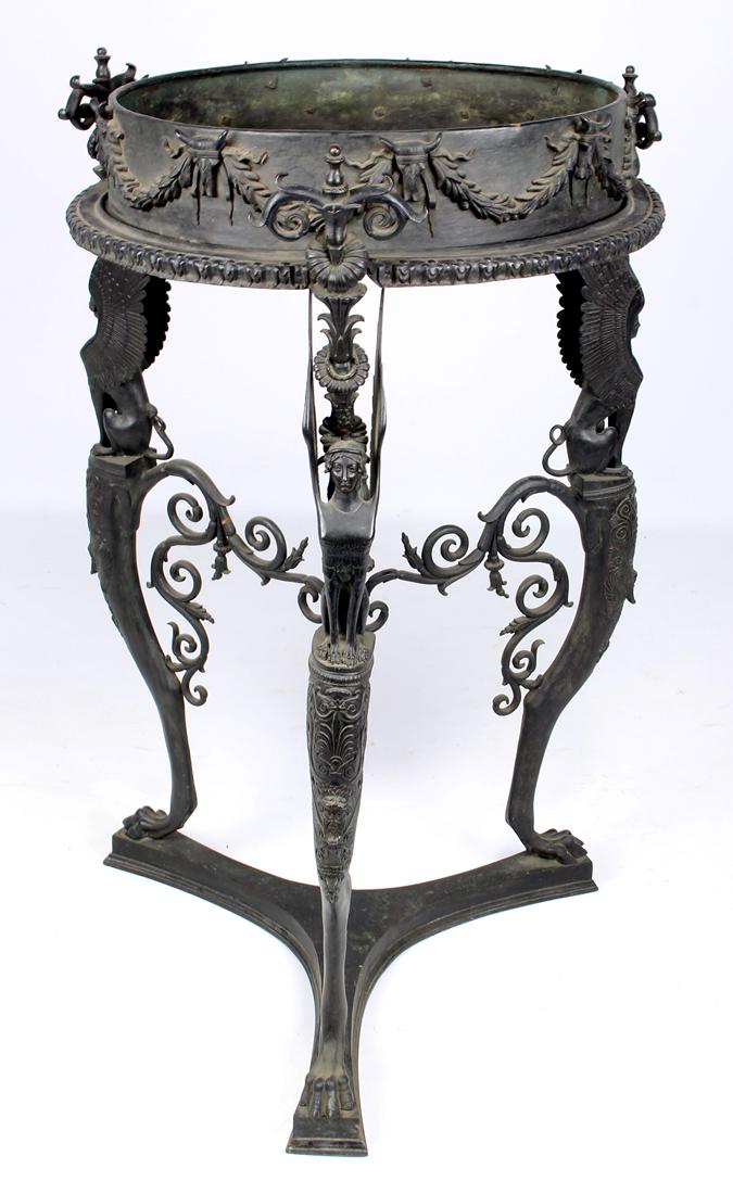 POMPEII-STYLE BRONZE AND IRON GUERIDON: removable, deep, round tray top on tripod base, Sphinx decorated knees with lion paw feet, 36"h; 22"diam.