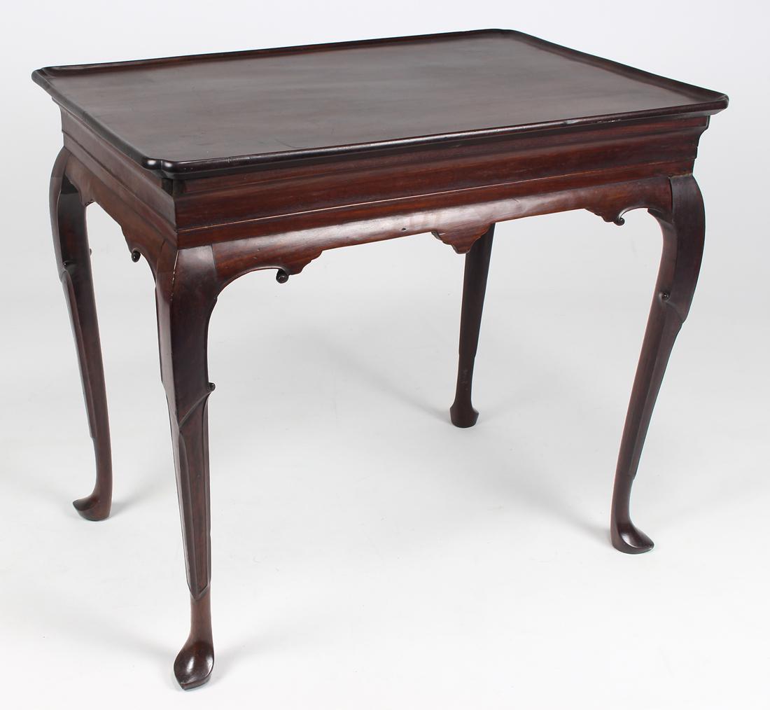 18TH C. IRISH MAHOGANY TRAY-TOP TEA TABLE: old surface, elegant scroll-carved apron, unusual carved cabriole legs, on shaped pad feet, 27.5"h; 31"w; 20.5"d