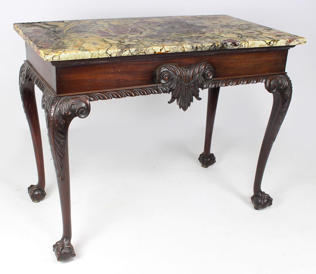IRISH GEORGE II CARVED MAHOGANY PIER TABLE: grey, rouge and cream marble top, carved scrolling acanthus leaf to gadrooned apron, acanthus carved knees, ball and claw feet, 33.25"h; 42"w; 23"d incl. marble Prov.; Sotheby Parke Ber