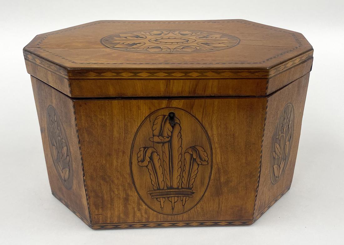 GEORGE III INLAID SATINWOOD TEA CADDY: 19th c., octagonal-form, Prince of Wales plumes decoration, fitted with double lidded compartments, 5.25"h; 8"w; 4.5"d