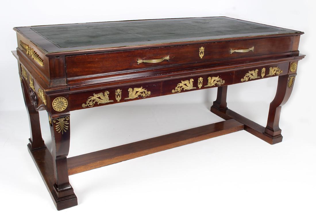 FRENCH EMPIRE-REVIVAL MAHOGANY ORMOLU-MOUNTED DESK: late 19th c., rectangular writing surface with inset green leather, the drawer below a pull-out desk, fitted with compartments, 34"h; top, 69"w; 33.5"d From the home of an Oyster Bay, N