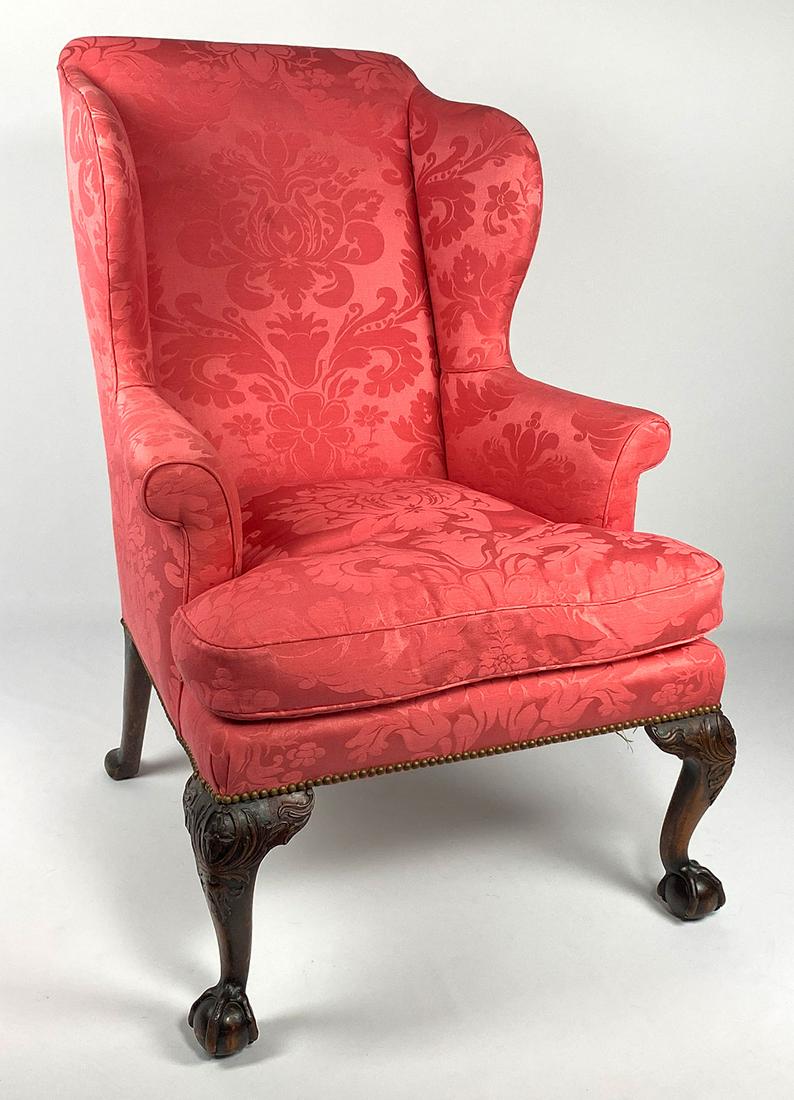 IRISH CHIPPENDALE MAHOGANY WING CHAIR: 18th c., carved knees, ball and claw feet, 44.5"h; 25"w