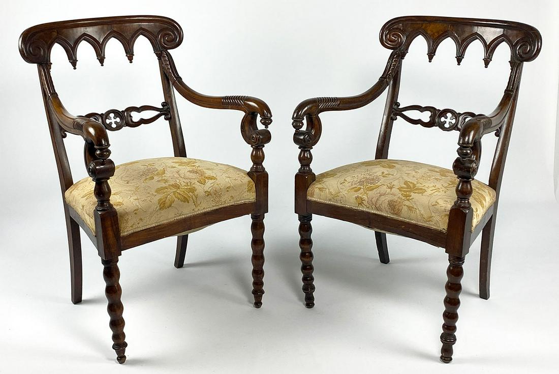 PAIR OF ENGLISH GOTHIC-STYLE MAHOGANY ARMCHAIRS: 19th c., Gothic arched crest, carved scrolling arms, upholstered seat, bobbin turned front legs, 36"h; 22"w; 20"d