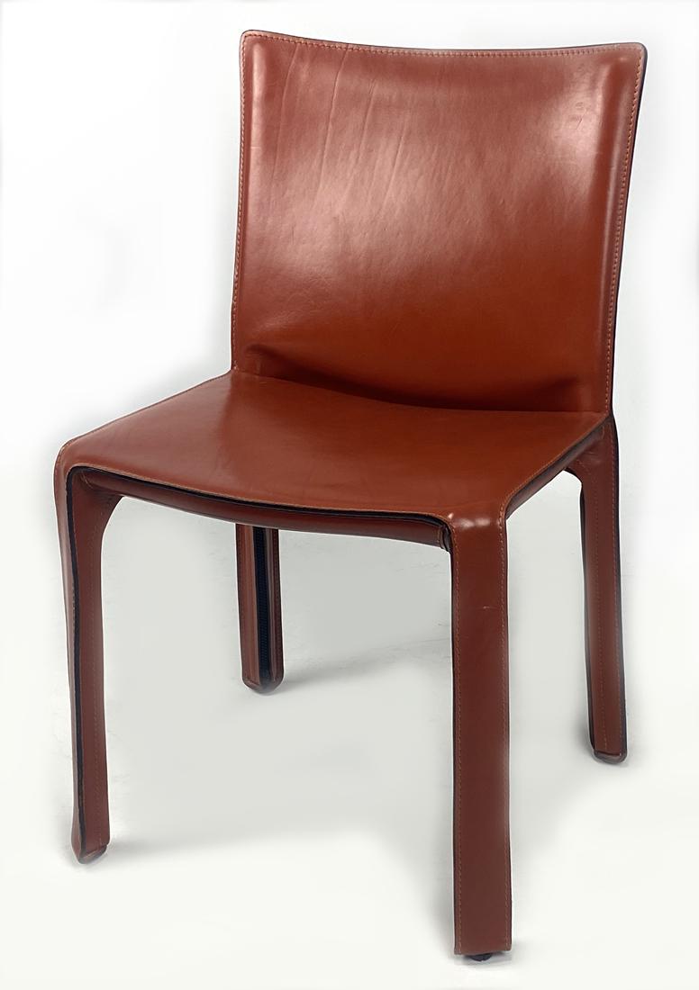 SET OF (8) LEATHER 412 CAB CHAIRS, BELLINI FOR CASSINA: designed Mario Bellini for Cassina in 1977, stitched cuoio rosso cina colored saddle leather over steel frame, marked Cassina under seat, back 33"h; seat 18.5"w From