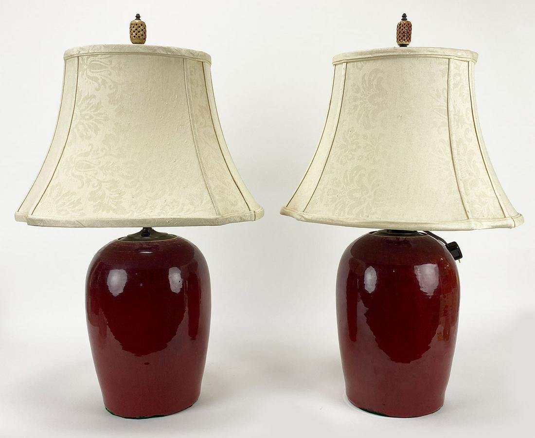 PAIR OF LARGE CHINESE SANG-DE-BOEUF TABLE LAMPS: 25.5"h (total incl. shades and finial)