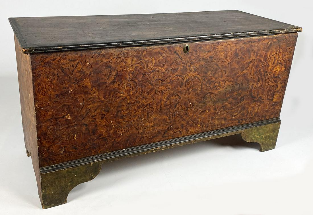 NEW ENGLAND PAINT DECORATED BLANKET CHEST: boot-jack ends, 27"h; 52"w; 21.5"d. From an historic Massachusetts home completely furnished and decorated with period furniture and accessories.