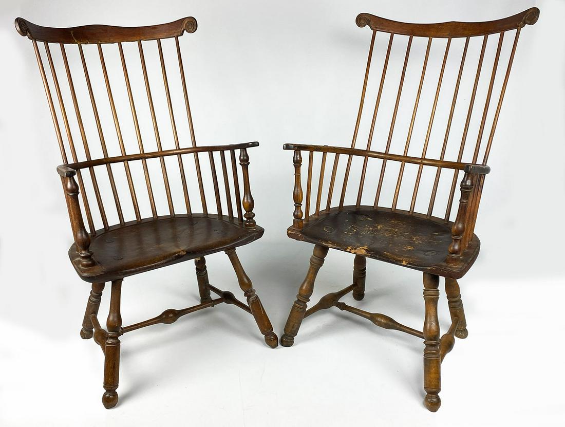 NEAR PAIR OF PHILADELPHIA WINDSOR COMB-BACK ARMCHAIRS: 10-spindle comb, carved shaped crest, saddle seat,on turned splayed legs joined by H-stretcher, back 45"h; seat 24"w; seat height 17"; the other, back 44"h; seat 24"w; seat he