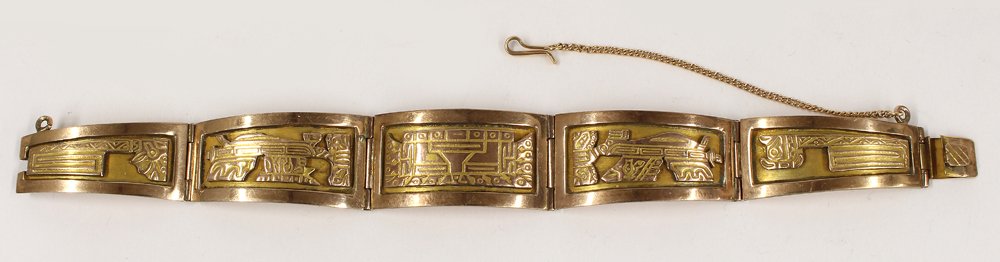 18K GOLD BRACELET: Peru, stamped on the inside panel, 18K, five tapering hinged panels, each with Pre-Columbian designs, wrist opening 2.5" diam.; 7.25" when laid out; 25.7 dwt. Purchased in Peru in 1968.