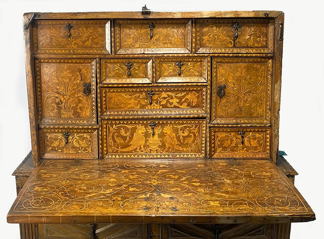 SPANISH RENAISSANCE VARGUENO: nine drawers and two cupboards with boxwood inlay of zoomorphic creatures, bird and scrolling leaf; the interior of lid with conforming inlay; iron Gothic hasp, with key; 23”h; 38”w; 17