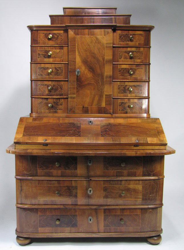 18TH C. GERMAN INLAID BURL WALNUT VENEER 5-PART SE: stepped top with molded edge, upper with center cabinet door flanked by (5) drawers, slant lid with simple fitted interior, overhanging rounded edge over (3) lower drawers, all with fine line and scro